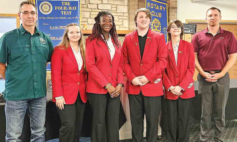 Livingston High School CTE (Career/Tech) Coordinator Blake Thornton and FCCLA students Emma Bradley, Jy’Asia Terry, Cole Gann and Sofia Fitzgerald stand with Rotary President Brandon Wigent after presenting a program for the Rotary Club of Livingston recently. Photo by Emily Banks Wooten