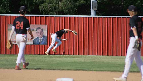 Groveton’s Cade White stretches for the fly ball. Photos by Tony Farkas